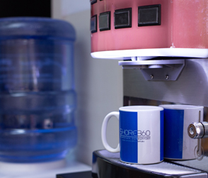 A photo of one of the coffee vendo machines at Shore360, Inc., offering barista-style coffee to the remote staff of clients.