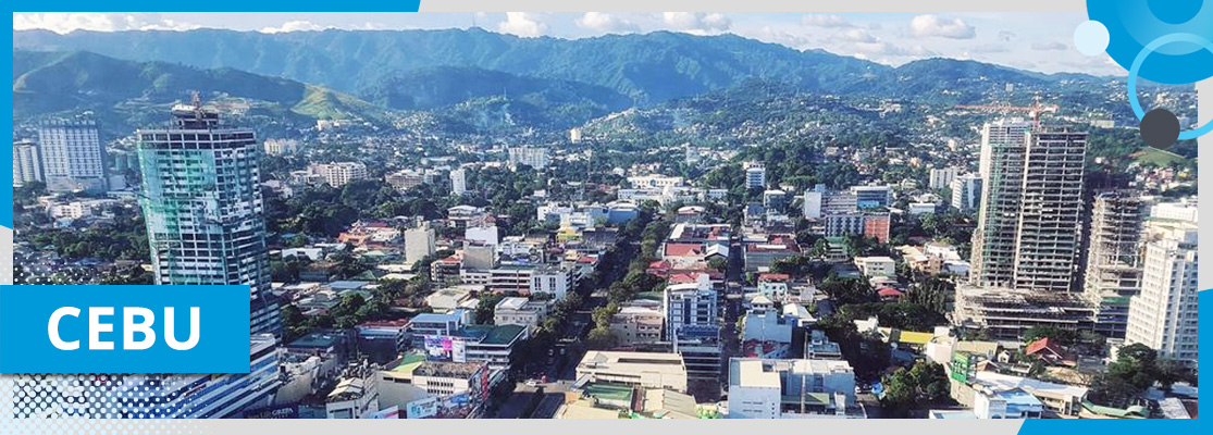An aerial view of Cebu City, Philippines, a large city surrounded by mountains. The text in the image says "Cebu".