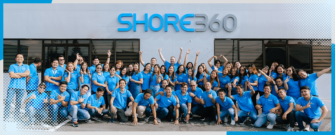 Shore360 team posing in front of Shore360 office in the Philippines.