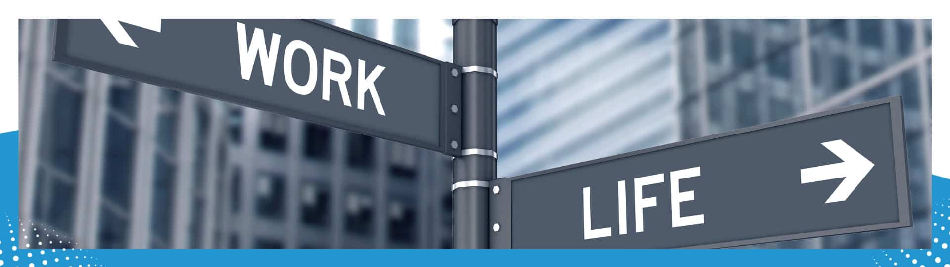 Street signs pointing in opposite directions labeled 'Work' and 'Life,' symbolizing the concept of work-life balance against a blurred urban backdrop.