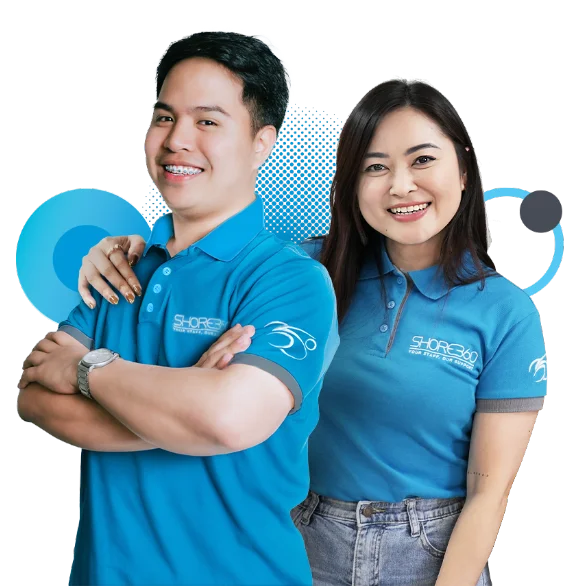 Two smiling Shore360 team members wearing blue company-branded polo shirts, standing confidently with arms crossed and casual attire, set against a transparent background with blue design elements.