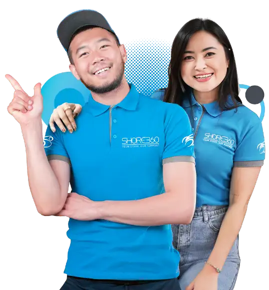 Two cheerful Shore360 team members in branded uniforms, exuding warmth and professionalism, with one member pointing confidently.
