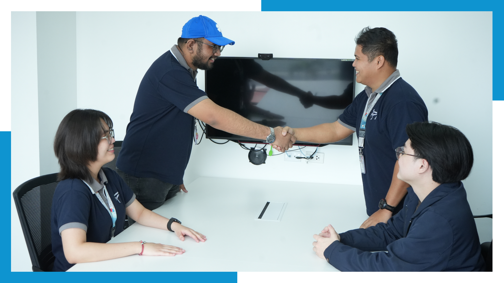 Shore360 outsourcing professionals in a client meeting, sealing partnership with a handshake to highlight trust and collaboration.