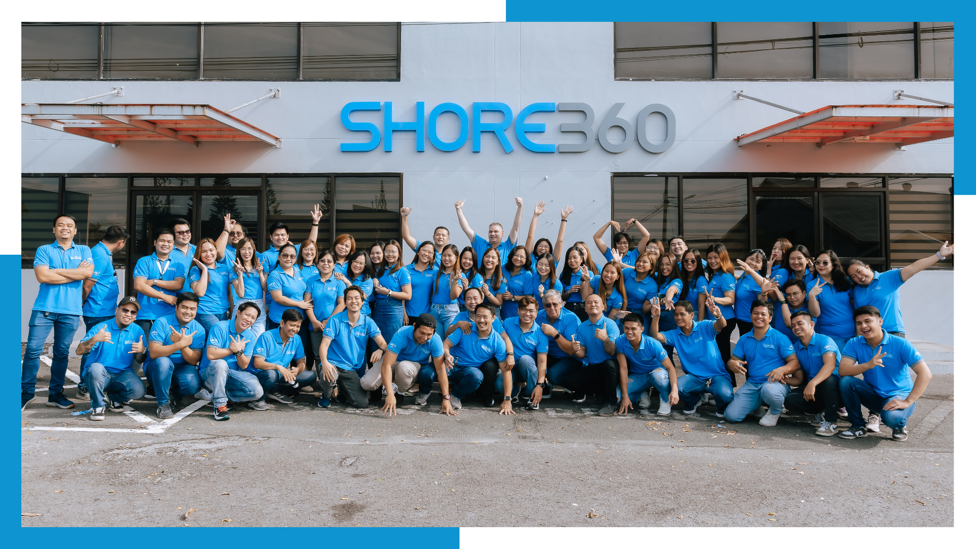 Shore360 Philippines team group photo in front of the company office building